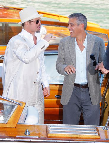 <p>George Pimentel/WireImage</p> Brad Pitt and George Clooney