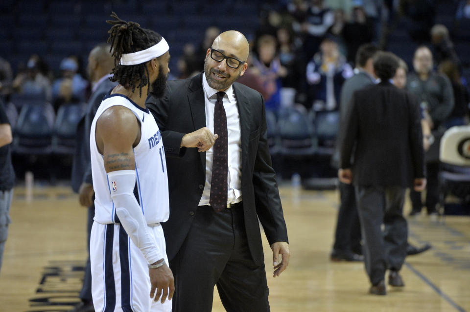 New York Knicks head coach David Fizdale, right, talks with Memphis Grizzlies guard Mike Conley after an NBA basketball game Sunday, Nov. 25, 2018, in Memphis, Tenn. (AP Photo/Brandon Dill)