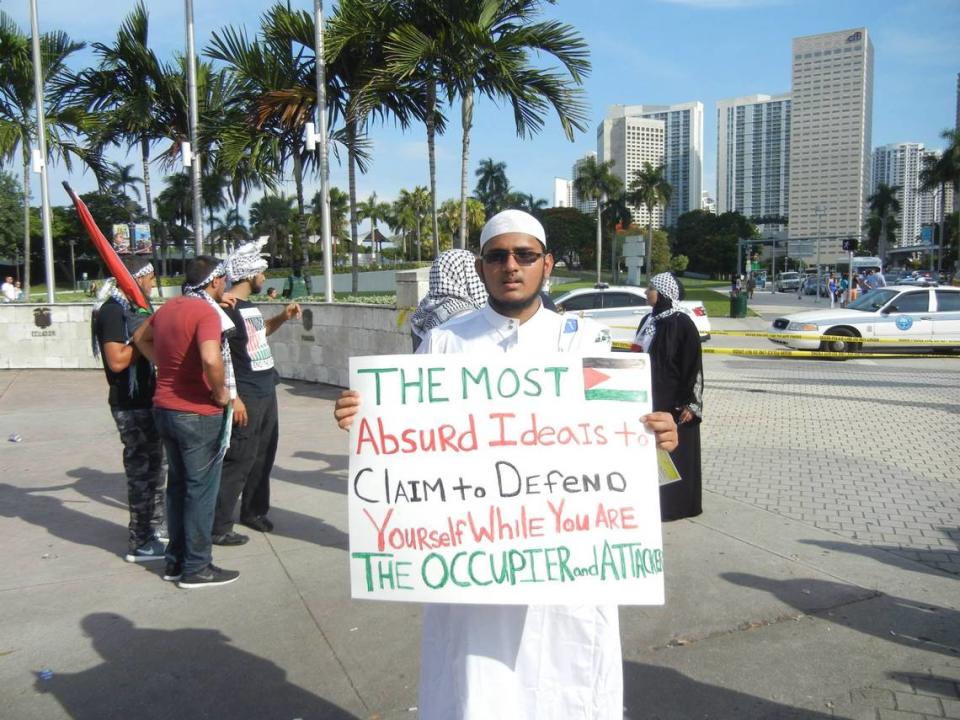 Salman Rashid, in a photo on Facebook, at a protest in Downtown Miami in 2014.