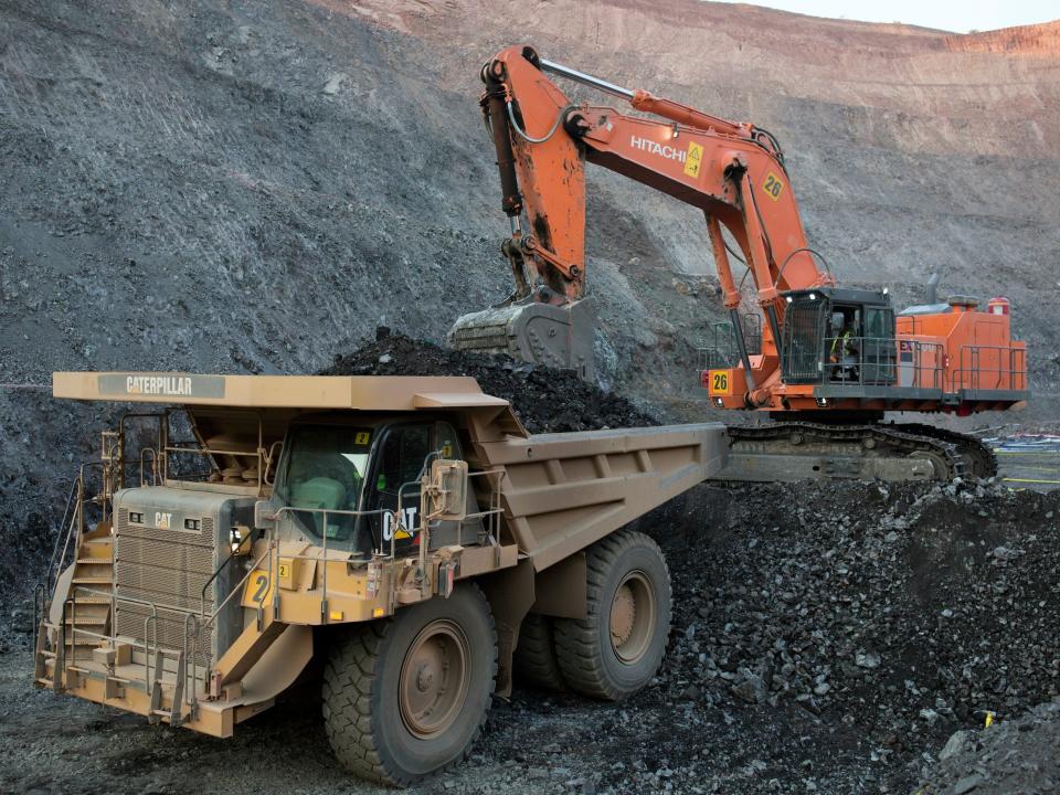 The sun sets on one of the open pit copper mines