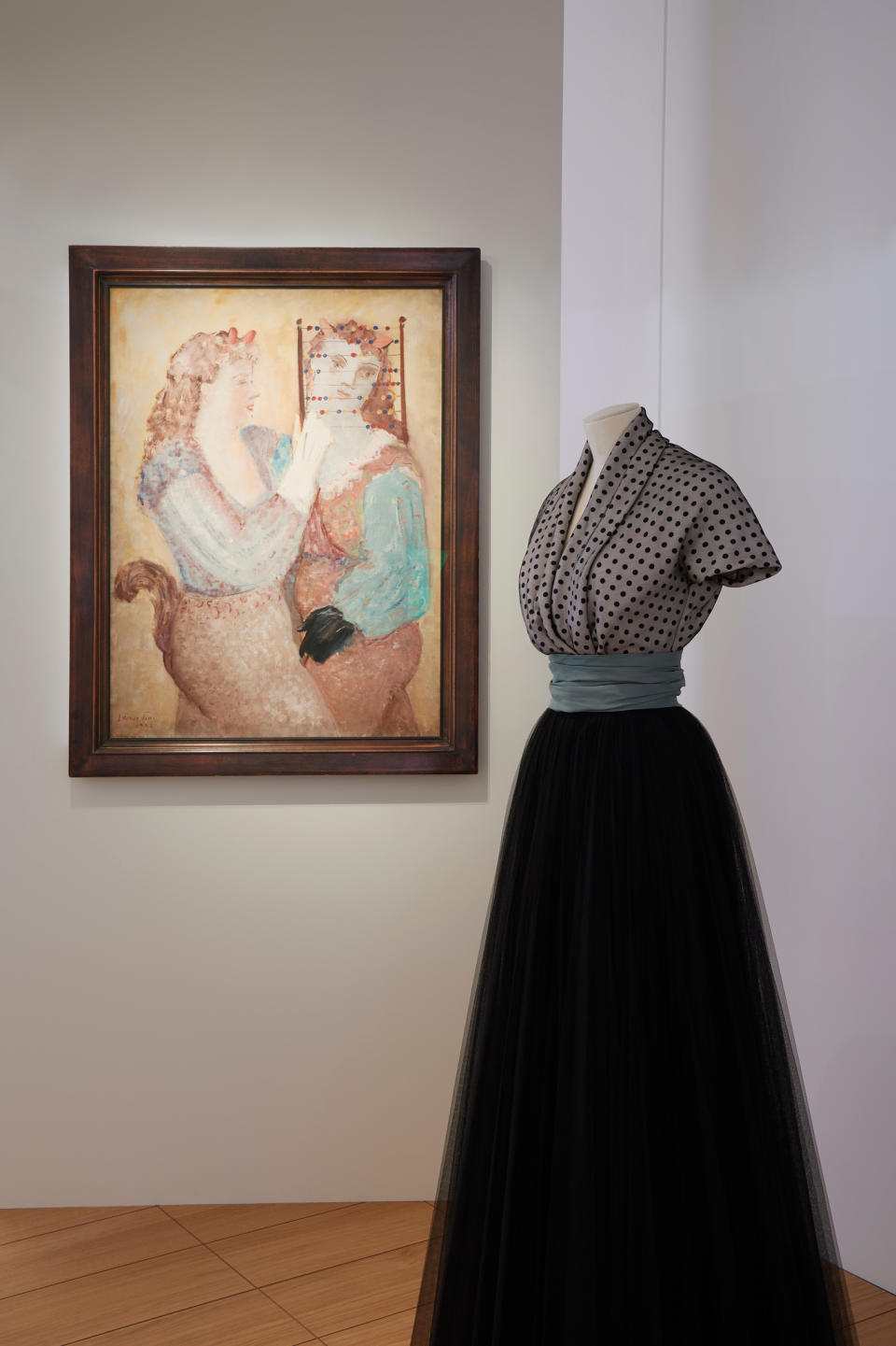 Christian Dior's Colette dress alongside a Leonor Fini painting.