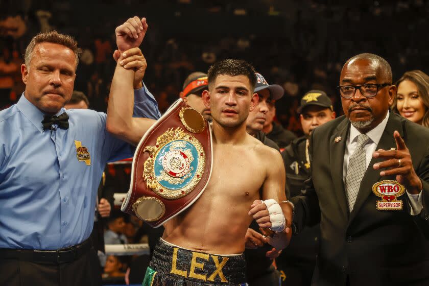 Alexis Rocha celebrates after defeating Luis Veron during a 10 Rounds vacant NABO welterweight title boxing match Saturday, July 16, 2022, in Los Angeles. (AP Photo/Ringo H.W. Chiu)
