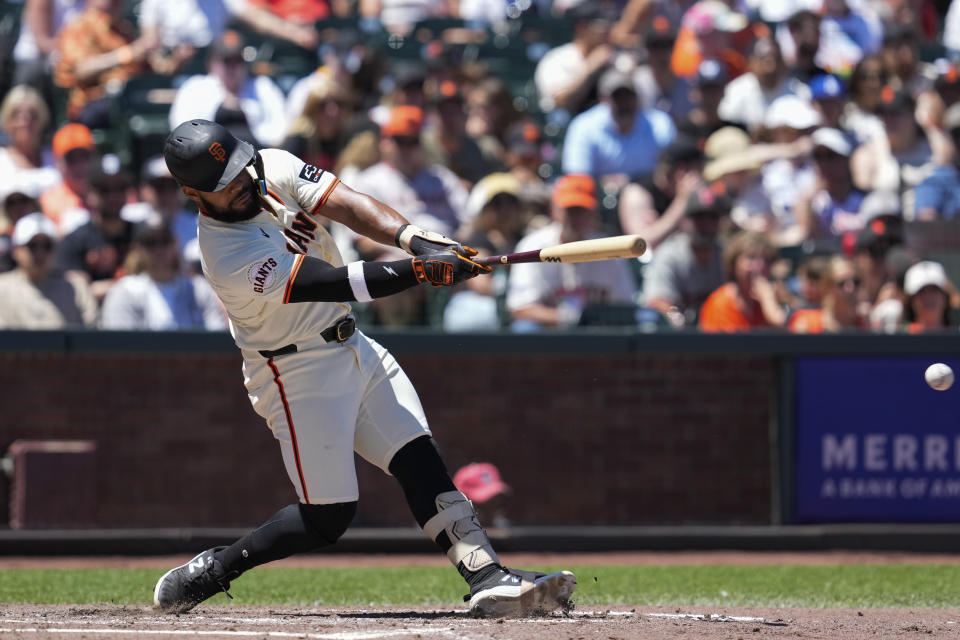 San Francisco Giants' Heliot Ramos hits an RBI double during the fifth inning of a baseball game against the Los Angeles Angels, Saturday, June 15, 2024, in San Francisco. (AP Photo/Godofredo A. Vásquez)