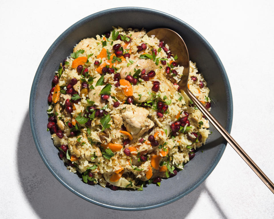 This image released by Milk Street shows a recipe for plov, a hearty pilaf, with chicken. (Milk Street via AP)