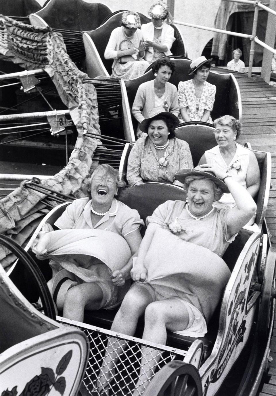 Women from Clapham enjoying a caterpillar ride on a pub outing in 1956 - Grace Robertson /Bonhams/PA Wire