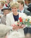 <p>While pinstripe is reminiscent of a baseball player's uniform, Diana, too, proved its fashion-forward appeal in a printed blazer over a navy top while greeting royal fans in Sheffield in 1991.</p>