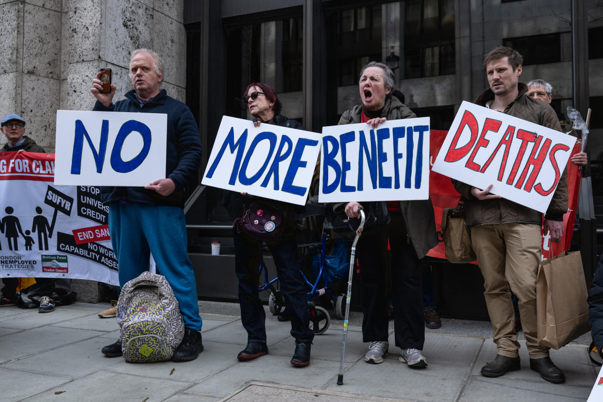 LONDON, ENGLAND - MARCH 4: Supporters of Disabled People Against Cuts (DPAC) and Winvisible protest against deaths caused by benefit cuts and sanctions at Department For Work and Pensions on March 4, 2024 in London, England. Disabled People Against Cuts called for a national day of protest at the UK Department of Work and Pension calling for no more deaths from benefits cuts. (Photo by Guy Smallman/Getty Images)