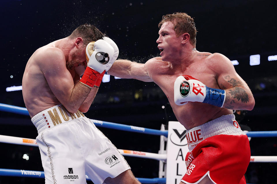 SAN ANTONIO, TEXAS - DECEMBER 19: In this handout image provided by Matchroom, Canelo Alvarez punches Callum Smith during their super middleweight title bout at the Alamodome on December 19, 2020 in San Antonio, Texas. (Photo by Ed Mulholland/Matchroom via Getty Images)