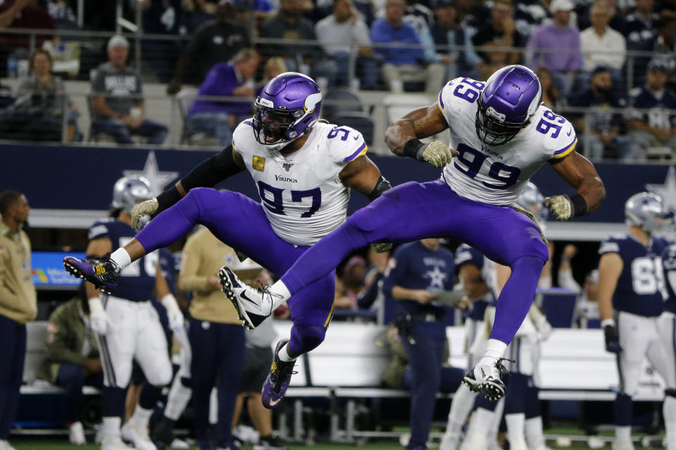 Minnesota Vikings' Everson Griffen (97) and Danielle Hunter (99) celebrate a sack of Dallas Cowboys' Dak Prescott during the second half of an NFL football game in Arlington, Texas, Sunday, Nov. 10, 2019. (AP Photo/Michael Ainsworth)