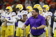 LSU head coach Ed Orgeron watches during warm ups before a NCAA College Football Playoff national championship game against Clemson Monday, Jan. 13, 2020, in New Orleans. (AP Photo/Sue Ogrocki)