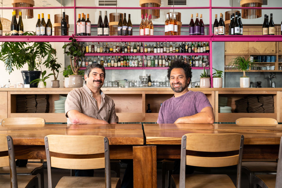 Seated at their restaurant Good Good Culture Club, in San Francisco, from left, co-owner Jeff Hanak and co-owner and chef Ravi Kapur. (Courtesy Gamma Nine)