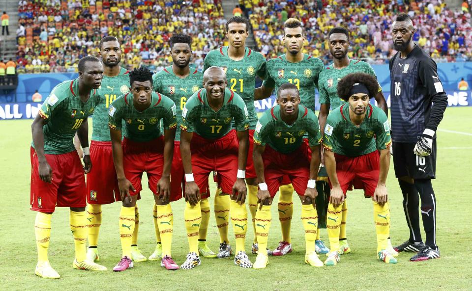 Cameroon players pose for a photo during the 2014 World Cup Group A soccer match between Cameroon and Croatia at the Amazonia arena in Manaus June 18, 2014. REUTERS/Murad Sezer