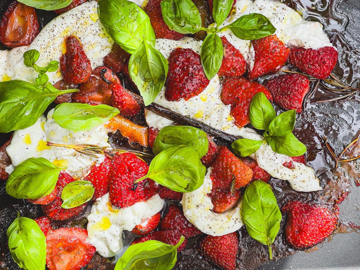 <span>Tom Hunt’s roast (over- or under-ripe) strawberries with basil, buratta and black pepper.</span><span>Photograph: Tom Hunt/The Guardian</span>