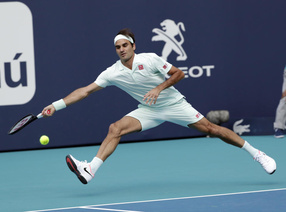 Roger Federer, of Switzerland, returns to Radu Albot, of Moldova, during the Miami Open tennis tournament, Saturday, March 23, 2019, in Miami Gardens, Fla. (AP Photo/Lynne Sladky)