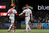 Cincinnati Reds closing pitcher Hunter Strickland (54) celebrates with catcher Aramis Garcia after the team's win over the San Francisco Giants in a baseball game in San Francisco, Friday, June 24, 2022. (AP Photo/John Hefti)