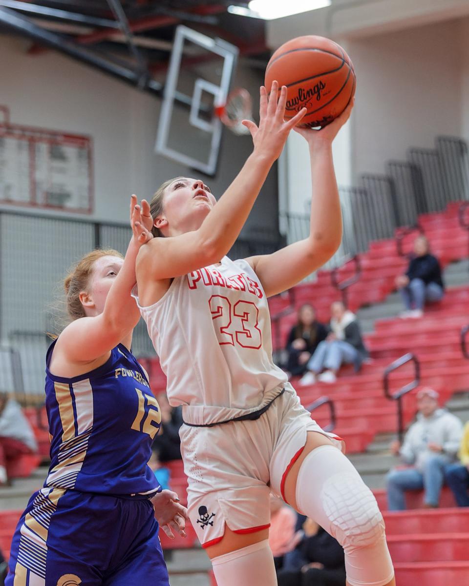 Pinckney's Audrey Wardlow drives to the hoop as Fowlerville's's Ava Rajala defends Thursday, Dec. 22, 2022.