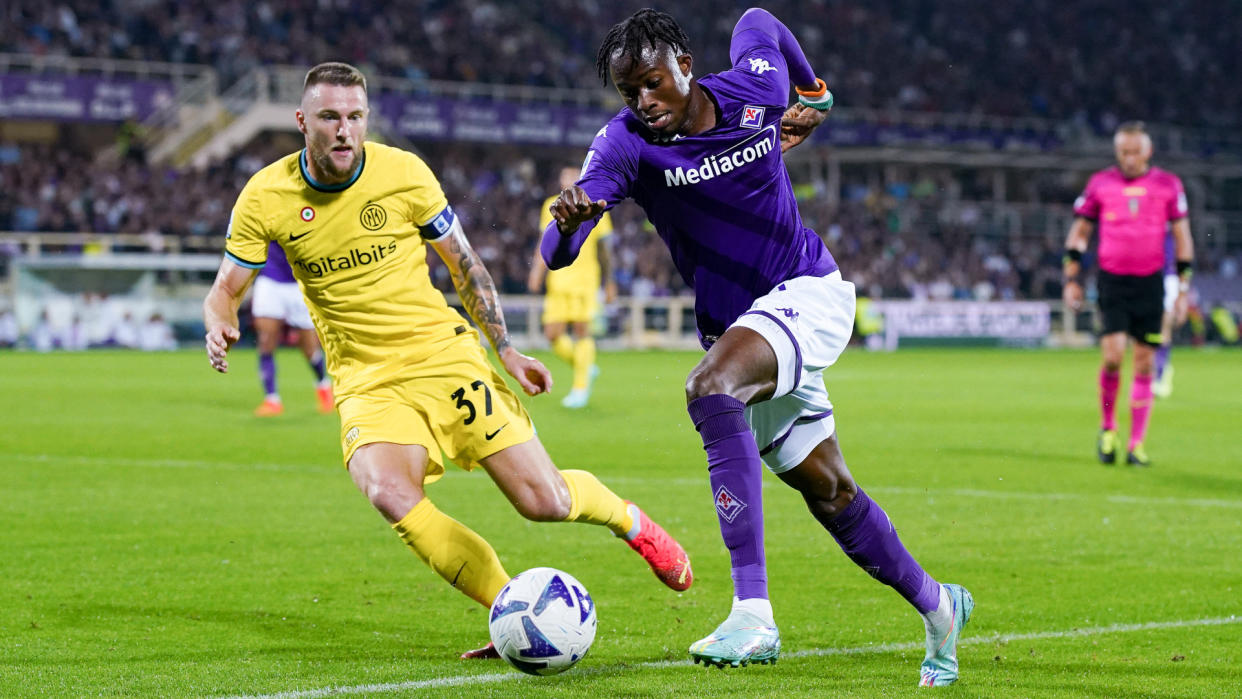  Christian Kouame of ACF Fiorentina and Milan Skriniar of FC Internazionale compete for the ball  