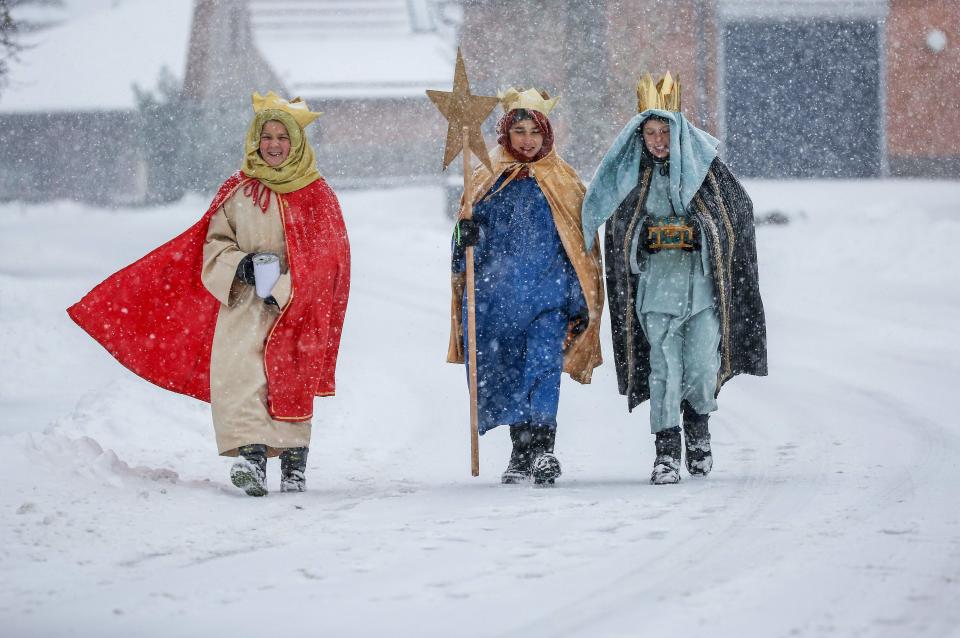 Carol singers dressed as the three Kings walk on the snow-covered path on the eve of the Epiphany celebrations on Jan. 5, 2019 in Lengenwang, Germany. 