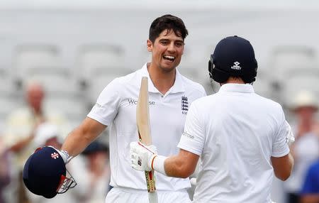 Britain Cricket - England v Pakistan - Second Test - Emirates Old Trafford - 22/7/16 England's Alastair Cook celebrates his century with Joe Root Action Images via Reuters / Jason Cairnduff Livepic