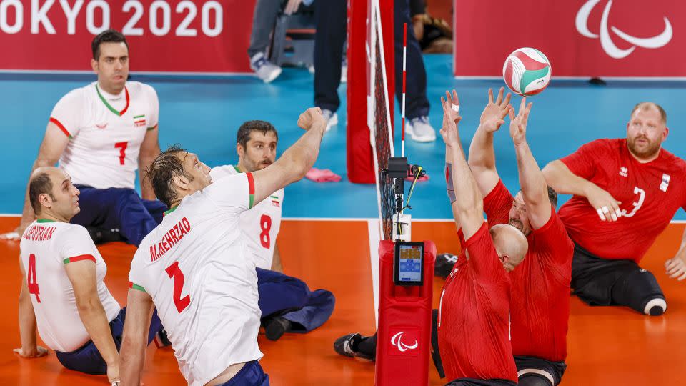 Morteza Mehrzad, the tallest Paralympian, competes for Iran against Russia during the men's sitting volleyball gold match at the Tokyo 2020 Paralympic Games. - Tasos Katopodis/Getty Images