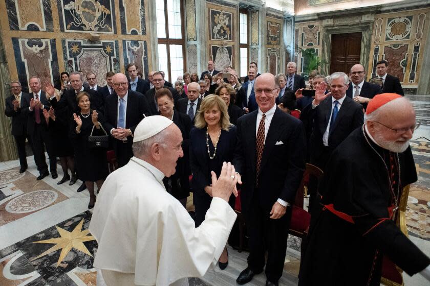 VATICAN, ITALY-May 2019-Pope Francis meets with members of The Papal Foundation on Friday, and thanks them for their support and for spreading the Gospel message of hope and mercy. The Papal Foundation is comprised of American Catholics who dedicate financial resources to supporting the Pope and various projects throughout the world, including Catholic leader Tim Busch, forth from the left, waving to the Pope. (Handout)