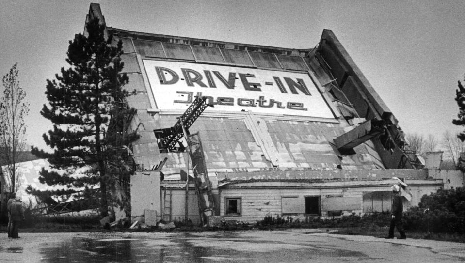 The screen at Bluemound Drive-In Theatre is toppled by workers, officially removing Wisconsin's first drive-in from the Brookfield landscape.