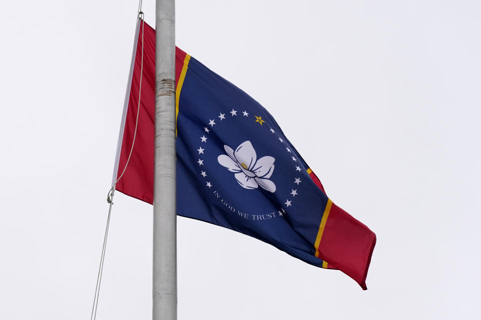 One of five final designs for the new Mississippi state flag flutters in the breeze, outside the Old Capitol Museum in Jackson, Miss., Aug. 25, 2020, in Jackson, Miss. In late June, Mississippi legislators voted to retire the last state flag to include the Confederate battle emblem, which is broadly condemned as racist. All five were flown outside the museum for viewing. The Mississippi State Flag Commission narrowed their choices to two flags, of which this is one. They will reconvene in September to make their final choice. (AP Photo/Rogelio V. Solis)