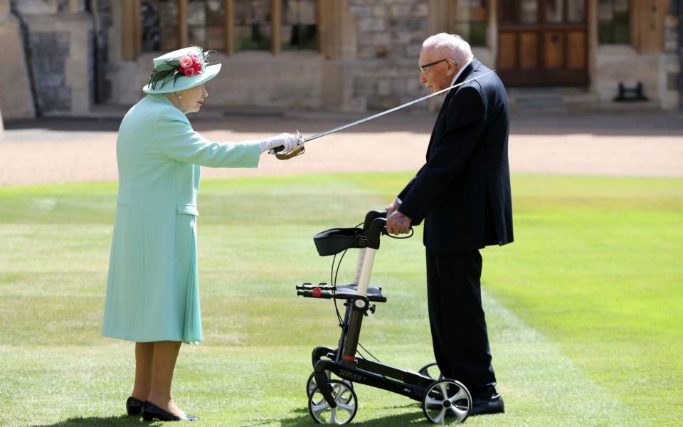 Captain Tom receiving his knighthood from the Queen during a special ceremony at Windsor Castle - Chris Jackson/PA