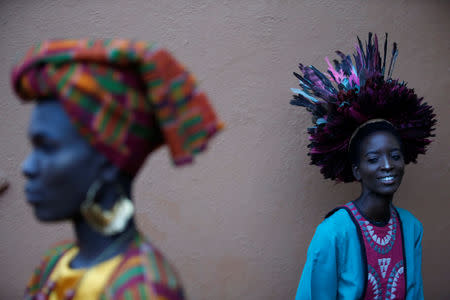 Models wait behind the scenes before a fashion show featuring African fashion and culture during a gala marking the launch of a book called "African Twilight: The Vanishing Rituals and Ceremonies of the African Continent" at the African Heritage House in Nairobi, Kenya March 3, 2019. REUTERS/Baz Ratner
