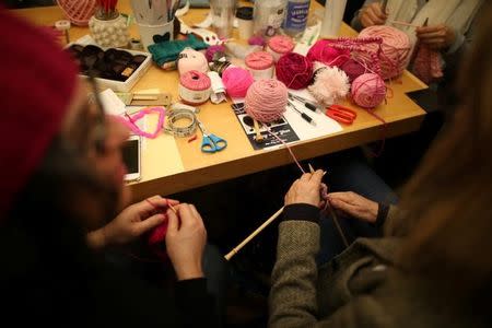 Knitters take part in the Pussyhat social media campaign to provide pink hats for protesters in the women's march in Washington, D.C., the day after the presidential inauguration, in Los Angeles, California, U.S., January 13, 2017. REUTERS/Lucy Nicholson