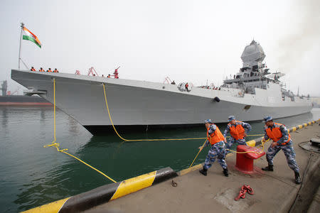 Chinese navy personnel moor the Indian Navy warship INS Kolkata at Qingdao Port for the 70th anniversary celebrations of the founding of the Chinese People's Liberation Army Navy (PLAN), in Qingdao, China, April 21, 2019. REUTERS/Jason Lee