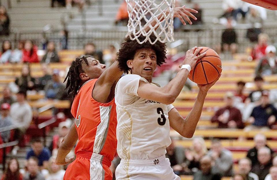 Sherman Oaks Notre Dame's Zachary White grabs a rebound against Bishop Gorman at the Nike Extravaganza.