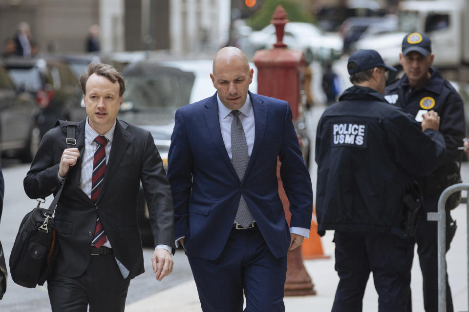 David Correia, center, arrives with his lawyers at federal court, Thursday, Oct. 17, 2019, in New York. Correia and Andrey Kukushkin were set to be arraigned Thursday on charges they conspired with associates of Rudy Giuliani to make illegal campaign contributions. (AP Photo/Kevin Hagen).