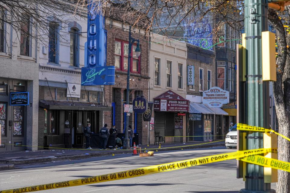 Austin Police investigate the scene of a shooting that left one man dead on Sunday, Dec. 17, 2023 on East 6th Street in Austin. The man was killed by Austin Police Officers late Saturday night after the man pointed a gun at officers and bystanders.