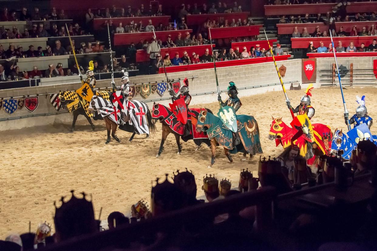 Six horsemen jousting at Medieval Times