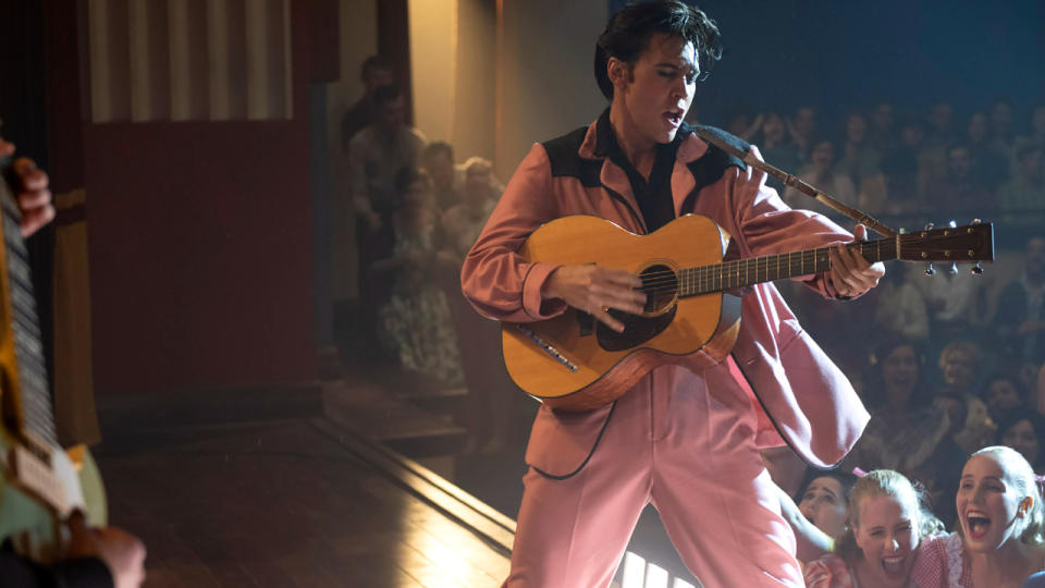 Austin Butler performing in a pink suit in Elvis.