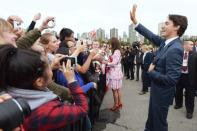 Prime Minister Justin Trudeau waves to onlookers alongside the Duchess of Cambridge at the Kitsilano Coast Guard station, in Vancouver on Sunday, Sept. 25, 2016. THE CANADIAN PRESS/Jonathan Hayward