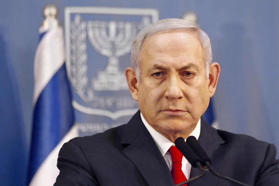 FILE - In this Nov. 18, 2018 file photo, Israeli Prime Minister Benjamin Netanyahu delivers a statement in Tel Aviv, Israel. Israeli media is reporting Monday, Dec. 24, 2018, that Prime Minister Benjamin Netanyahu’s ruling coalition government has agreed to call an early election for April 9. (AP Photo/Ariel Schalit, File)