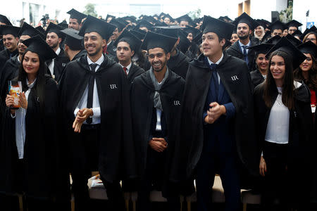 Students wearing mortar board hats wait to receive their degree diplomas, following a graduation ceremony for students at University of Rabat, Morocco, February 2, 2019. Picture taken February 2, 2019. REUTERS/Youssef Boudlal