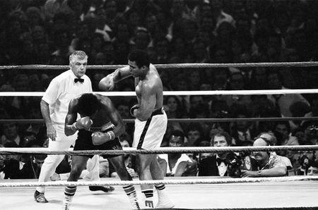 Muhammad Ali (R) drops an overhand right on Leon Spinks during their second match at the Louisiana Superdome in New Orleans, Louisiana, September 15, 1978. Ali regained the title, becoming the first three-time heavyweight champion. Action Images / MSI/File Photo