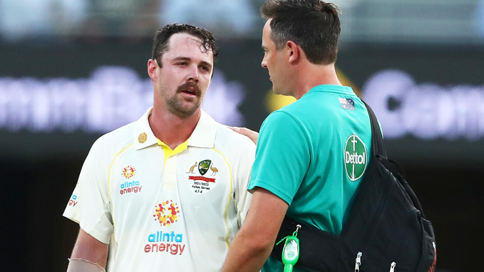 Travis Head, pictured here after being hit during day two of the first Ashes Test.