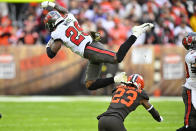 Tampa Bay Buccaneers running back Rachaad White (29) is upended by Cleveland Browns cornerback Martin Emerson Jr. (23) during the second half of an NFL football game in Cleveland, Sunday, Nov. 27, 2022. (AP Photo/David Richard)