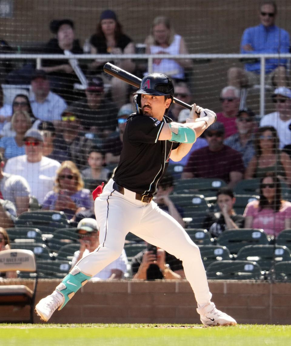 Arizona Diamondbacks outfielder Corbin Carroll bats against the Oakland A's in the first inning during a spring training game at Salt River Fields on March 11, 2024.