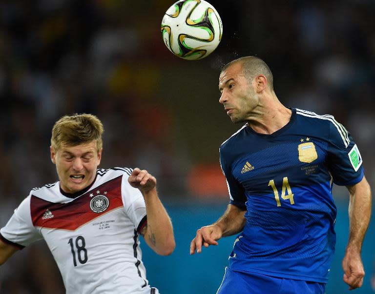 Germany's midfielder Toni Kroos (L) and Argentina's midfielder Javier Mascherano vie for the ball during the World Cup final in Rio de Janeiro, Brazil, on July 13, 2014