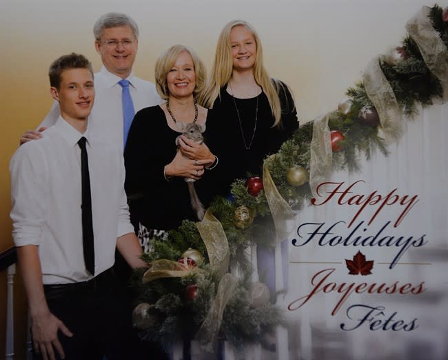 Prime Minister Stephen Harper is pictured with his son Ben, wife Laureen, holding Charlie the chinchilla, and daughter Rachel on their 2013 holiday card seen in Ottawa on Wednesday, Nov. 20, 2013. THE CANADIAN PRESS/Sean Kilpatrick