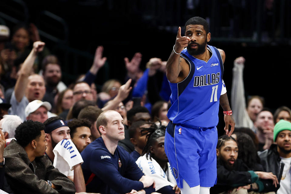 Dallas Mavericks guard Kyrie Irving celebrates a 3-point basket against the New Orleans Pelicans during the first half of an NBA basketball game Saturday, Jan. 13, 2024, in Dallas. (AP Photo/Brandon Wade)