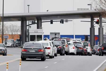 Cars enter the front gate at the Boeing South Carolina Plant while voting started Wednesday whether the plant will be unionized in North Charleston, South Carolina, U.S. February 15, 2017. REUTERS/Randall Hill