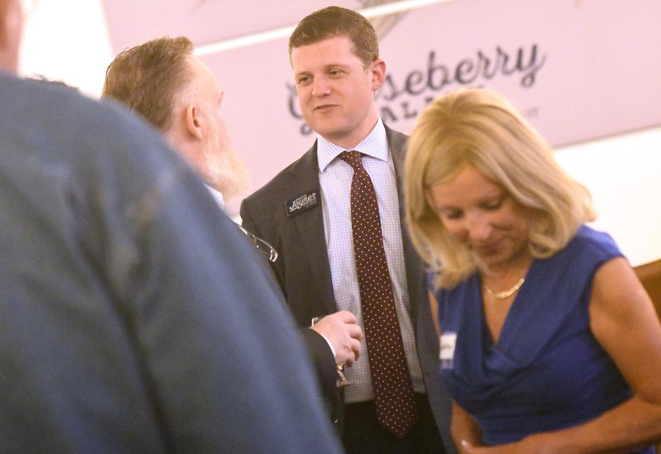 Wilmington City Council candidate David Joyner talks with supporters as election results begin to come in Tuesday at Bull City Ciderworks. Joyner is one of two new members to the council and will join Salette Andrews in December.