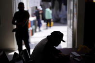 FILE - A man from Nicaragua sits at a shelter for migrants, April 21, 2022, in Tijuana, Mexico. The Supreme Court has ruled that the Biden administration properly ended a Trump-era policy forcing some U.S. asylum-seekers to wait in Mexico. The justices’ 5-4 decision for the administration came in a case about the “Remain in Mexico” policy under President Donald Trump. (AP Photo/Gregory Bull, File)