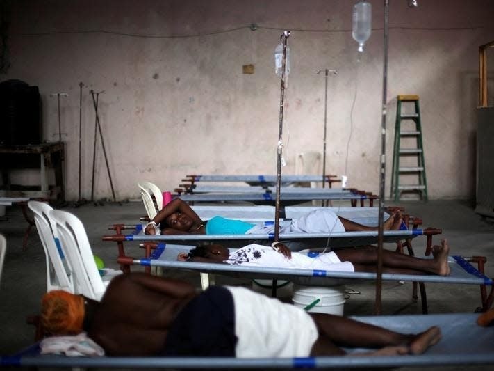 Patients rest on stretchers in the Cholera Treatment Center of Diquini in Port-au-Prince, Haiti, May 28, 2016. REUTERS/Andres Martinez Casares